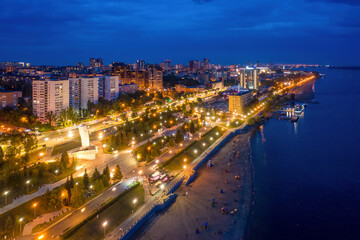 Drone view of Samara, Volga embankment and the beach at night. Samara Oblast, Russia.
