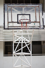 The basketball backboard has a steel frame base.