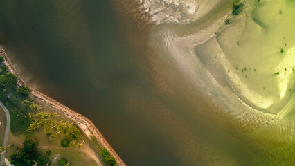 Aerial top view on sand beach, palm tree, ocean and boat.