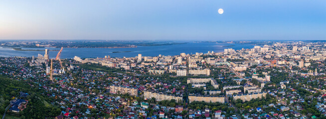 Obraz na płótnie Canvas Panoramic aerial view of Saratov and and Volga River on morning blue hour. Saratov Oblast, Russia.