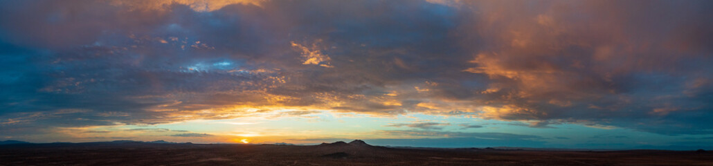 Fototapeta na wymiar A beautiful clouded sunset over the Mojave desert. 
