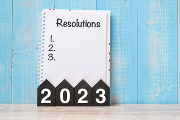 2023 Happy New Year with RESOLUTION word and wooden number. time for a New Start, goal, Plan, Action and Mission Concept