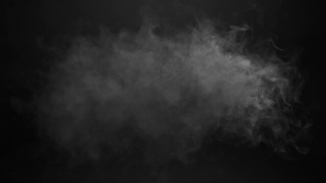Animation of cloud of grey smoke appearing and disappearing on black background