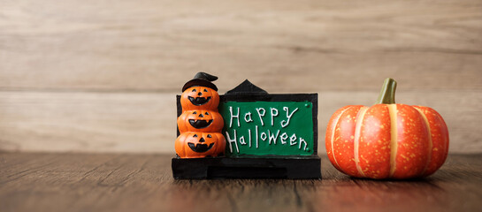 Orange pumpkin on table with copy space for banner background. Happy Halloween day, Hello October,...