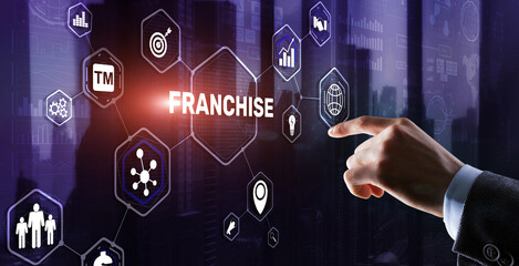 Businessman hand touching inscription Franchise marketing system