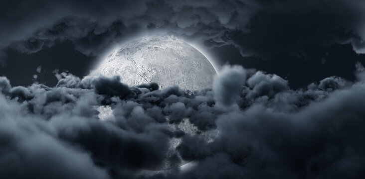 Shining moon hide by dark grey clouds in the sky 