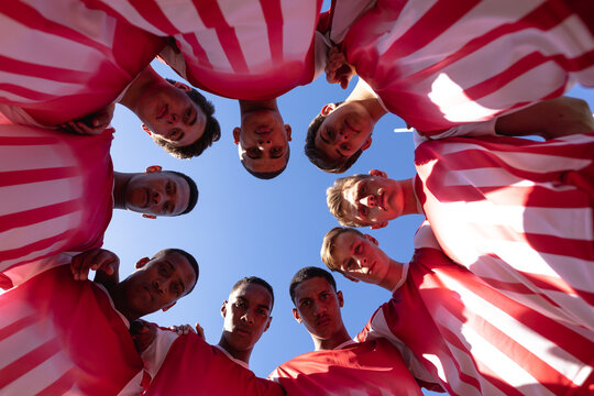 Low angle view rugby players standing in a semi circle