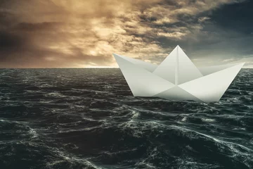 Foto op Canvas Paper boat floating on the sea © vectorfusionart
