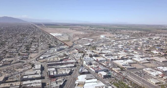 Drone flying back over a Mexico aside the border of the United States of America