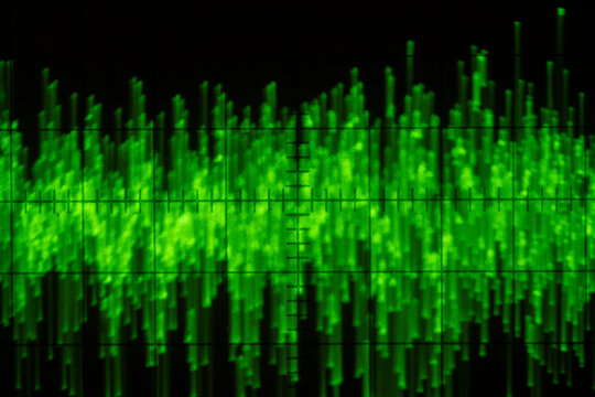 Audio signal on oscilloscope screen. Communication and electronics. Close up