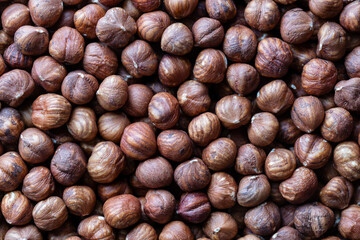 Dry hazelnuts background. Heap of peeled hazelnuts kernels