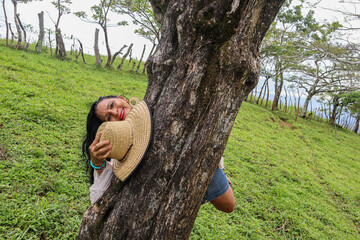 Woman Hugging a Tree