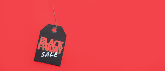 Tag with text BLACK FRIDAY SALE on red background with space for text