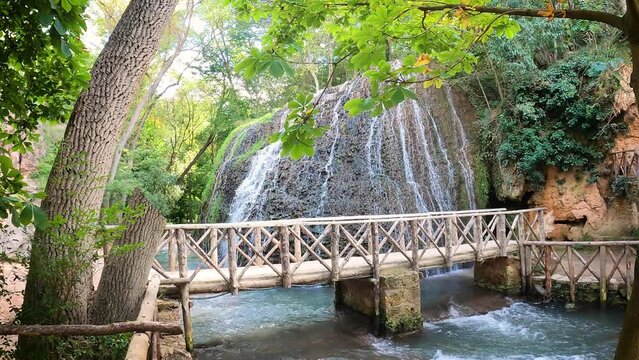 wooden pedestrian bridge in front of waterfall Iris at Monasterio de Piedra park (Stone Monastery), Nu&eacute;valos, province of Zaragoza, Aragon, Spain