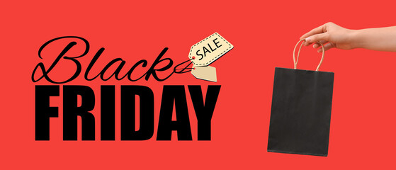 Female hand holding shopping bag and text BLACK FRIDAY SALE on red background
