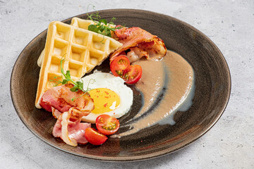 belgian waffle with bacon and cherry tomatoes
