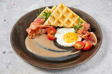 belgian waffle with bacon and cherry tomatoes