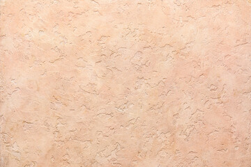 Beige concrete wall as background, closeup