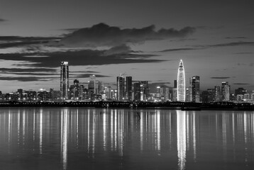 Fototapeta premium Skyline of Shenzhen city, China at dusk. Viewed from Hong Kong border Lau Fau Shan