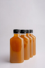 fruit juice plastic cold bottles of water isolated on white background