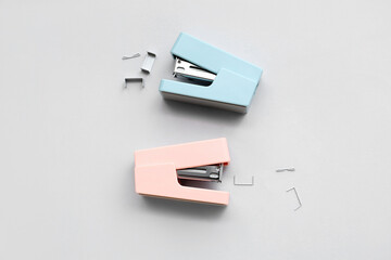 Office staplers with staples on white background