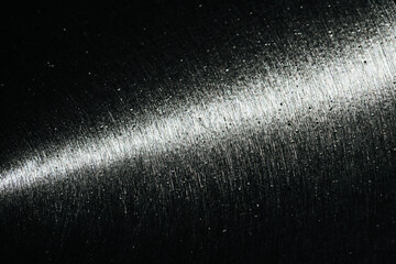 Metal part of a wheel scratched with disk brakes with thin line of light