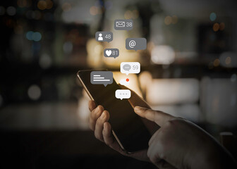 Person hand using a smartphone with social media marketing concept.