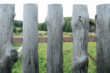 Cheap old wooden slab fence texture on a metal frame