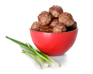 Bowl with tasty meat balls and green onion on white background