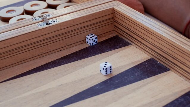 close-up shot of the dice rolled in a backgammon game. rolling dice. slow motion,4K
