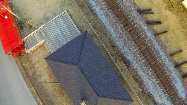 Aerial Shot Of House By Railroad Tracks, Drone Flying Forward Over City - Buckner, Missouri