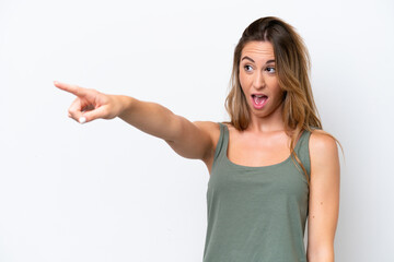 Young caucasian woman isolated on white background pointing away