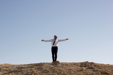 Businessman spread his arms