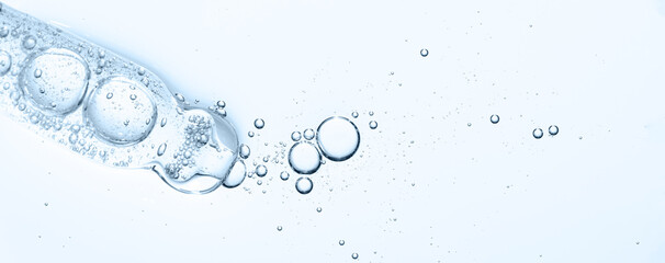 The texture of a cosmetic serum with a pipette closeup. Macrophotography