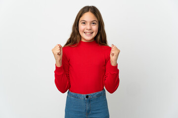 Little girl over isolated white background celebrating a victory in winner position