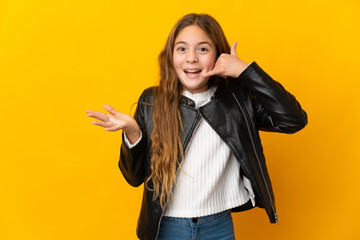 Child over isolated yellow background making phone gesture and doubting