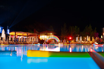 Swimming pool at a luxury resort at night time