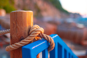 Naklejka premium Rope knot of handrail of a bridge