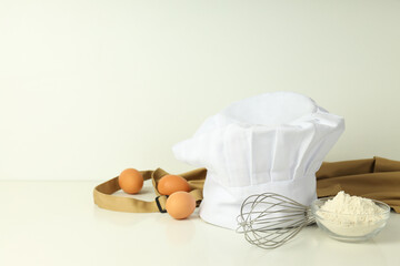 Composition with chef hat for concept of cooking, space for text
