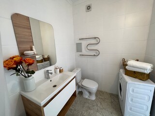 Bathroom with various household accessories and appliances.