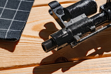 Shotgun parts on the wooden table background.
