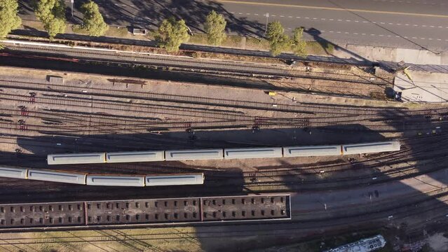 Adjacent parallel cargo passing trains at Federico Lacroze Buenos Aires