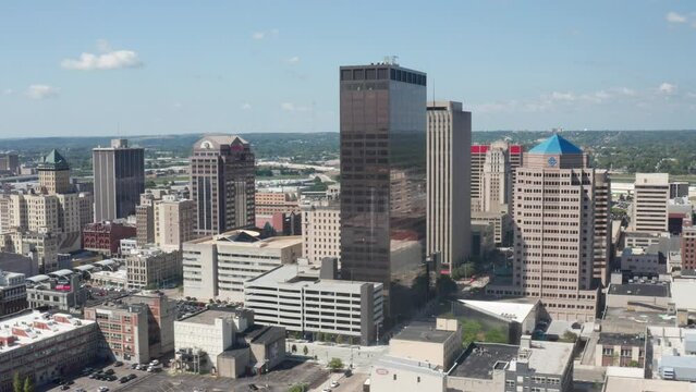 Dayton, Ohio skyline and river with drone video moving left to right.