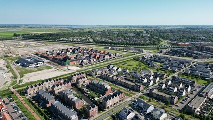 Drone shot of the Assendelft town houses and green streets in The Netherlands