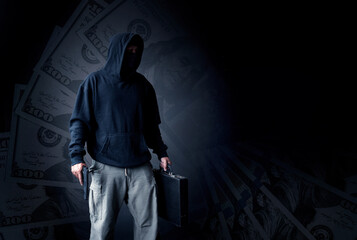 Double exposure thief or bandit man wearing black mask and holding gun on hand to make crime this a...