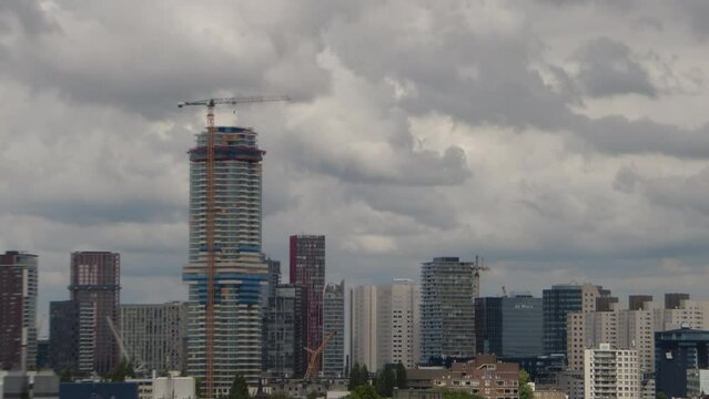 a time-lapse of this cloudy to sunny Rotterdam skyline