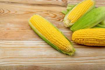 Sweet Corn Ears on Wooden Desk