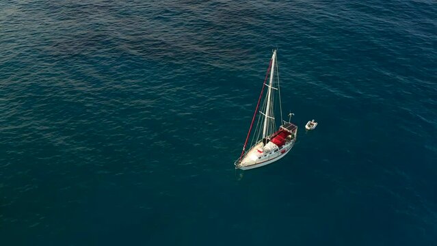 Aerial Of Sailboat Floating In The Ocean In The Morning