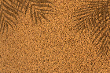 Fototapeta na wymiar Palm background, interesting image background consisting of roughcast with beautiful shadow of palm leaves. Copy space for your design. Web banner. 