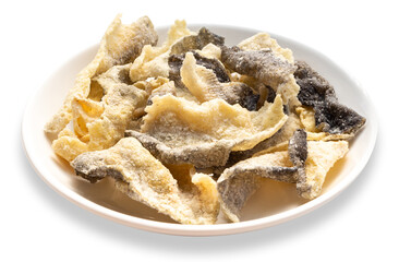 Crispy fried fishCrispy fried fish skin in cup on white background, clipping path included. skin in cup on white background.